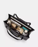 Coach Maggie Tote Bag
In Blocked Signature Canvas