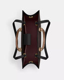 Coach Maggie Tote Bag
In Blocked Signature Canvas